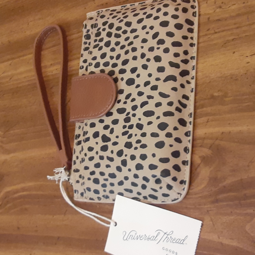 Universal thread goods and co wristlet
